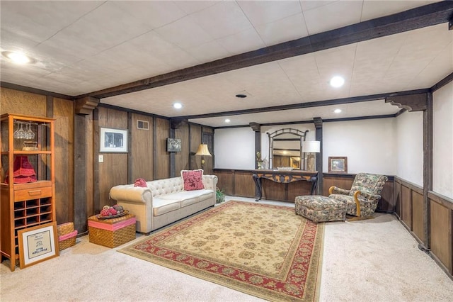 carpeted living room featuring wood walls, wainscoting, beam ceiling, and recessed lighting