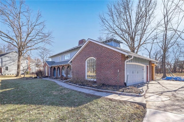 view of property exterior with a garage, concrete driveway, a lawn, a chimney, and brick siding