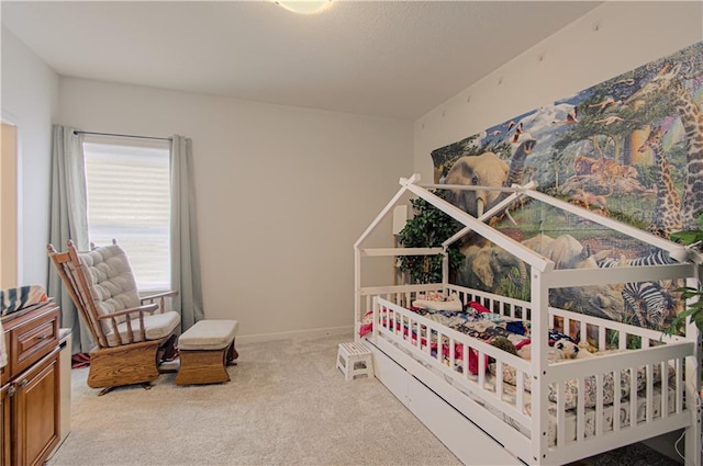 bedroom with carpet and baseboards