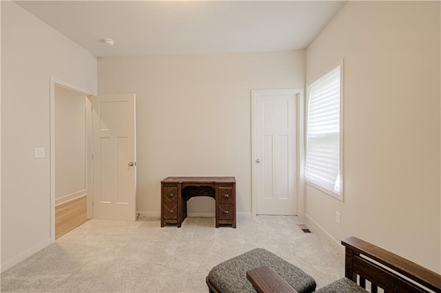 sitting room featuring carpet, visible vents, and baseboards