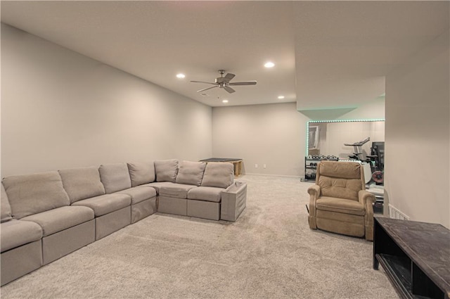 living area featuring carpet floors, a ceiling fan, and recessed lighting