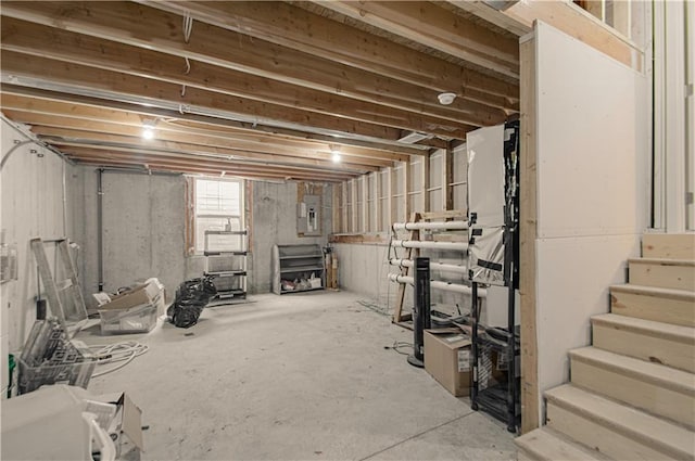 basement with stairs and electric panel