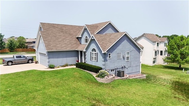 view of front of house featuring stucco siding, a garage, cooling unit, driveway, and a front lawn