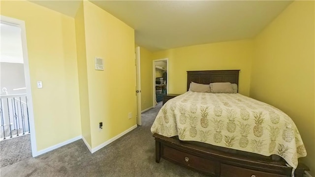 bedroom featuring dark colored carpet and baseboards