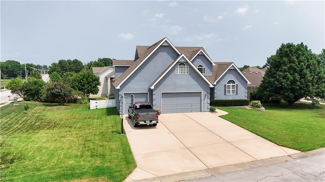 view of front facade featuring concrete driveway, a front lawn, and stucco siding