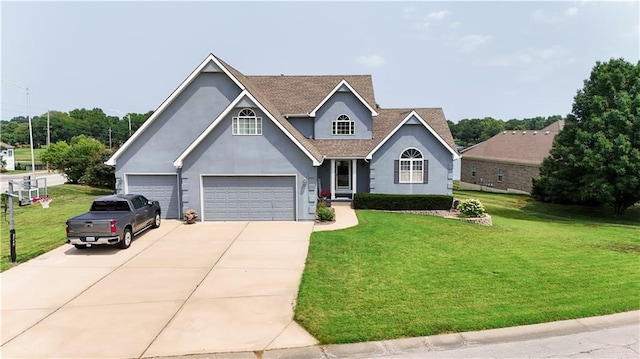 traditional home featuring driveway, stucco siding, a garage, and a front yard