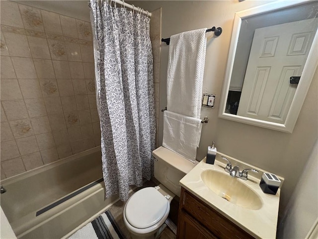 bathroom with shower / tub combo, vanity, and toilet