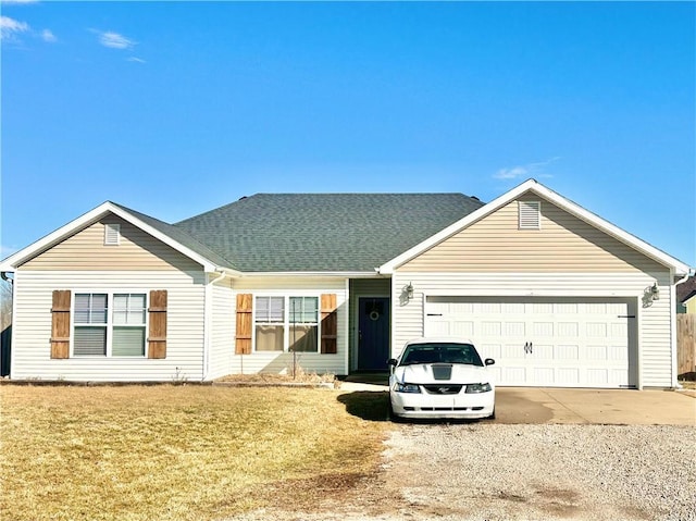 single story home featuring a front lawn, concrete driveway, roof with shingles, and an attached garage