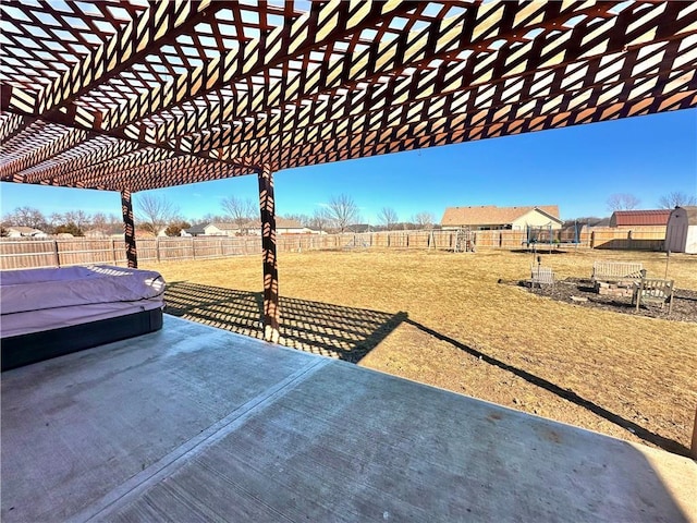 view of yard with a pergola, fence, and a patio