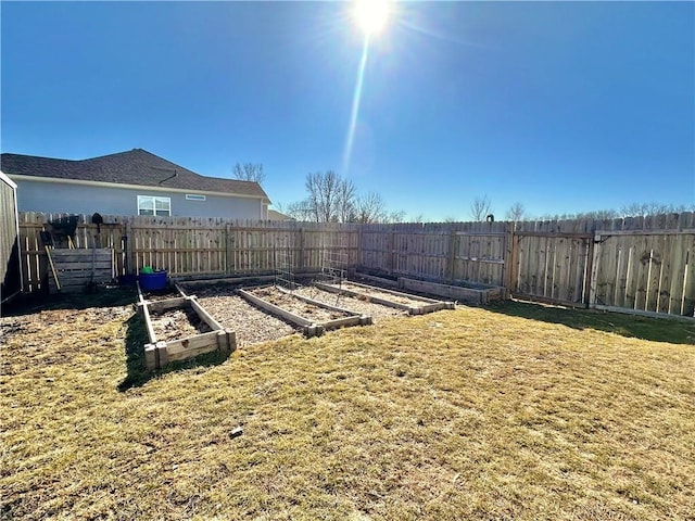 view of yard with fence private yard and a vegetable garden