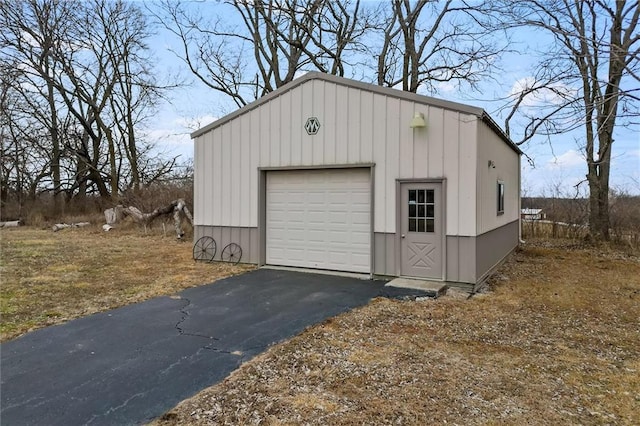 detached garage featuring driveway