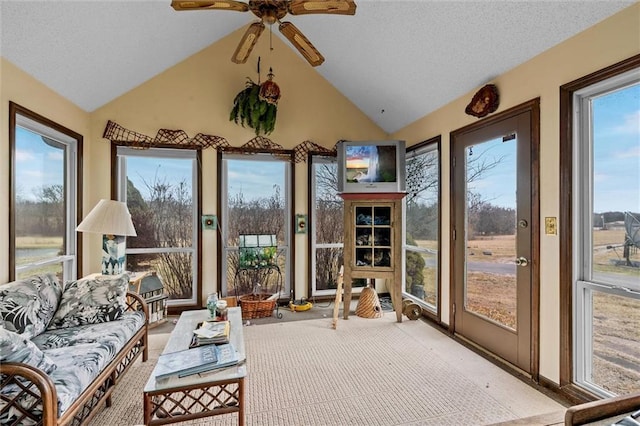 sunroom / solarium featuring a ceiling fan and lofted ceiling