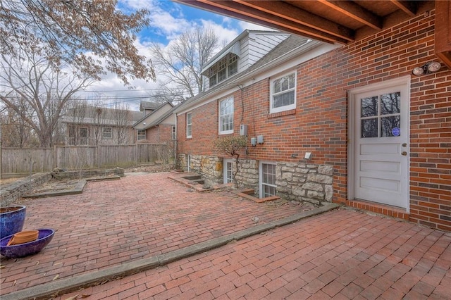 view of patio featuring fence