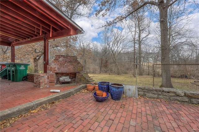 view of patio with exterior fireplace