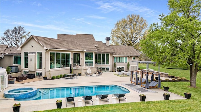 back of property with a yard, a tile roof, a patio, and a pergola