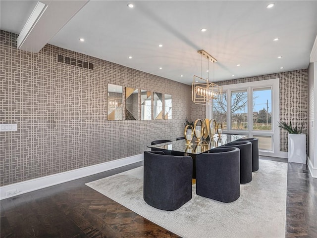 dining room with baseboards, an inviting chandelier, and recessed lighting