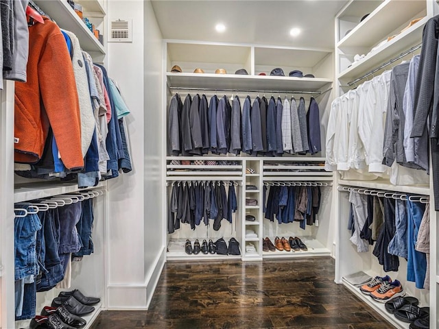 walk in closet with visible vents and wood finished floors