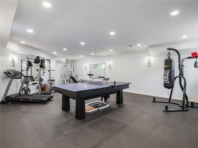 game room featuring baseboards, ornamental molding, and recessed lighting