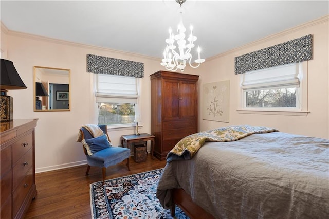 bedroom with an inviting chandelier, dark wood-type flooring, crown molding, and baseboards