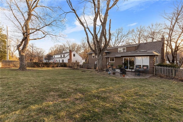 view of yard with a patio area and a fenced backyard