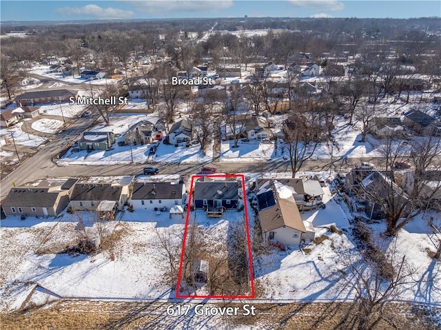 snowy aerial view featuring a residential view