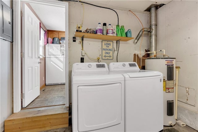 laundry room featuring laundry area, water heater, and independent washer and dryer