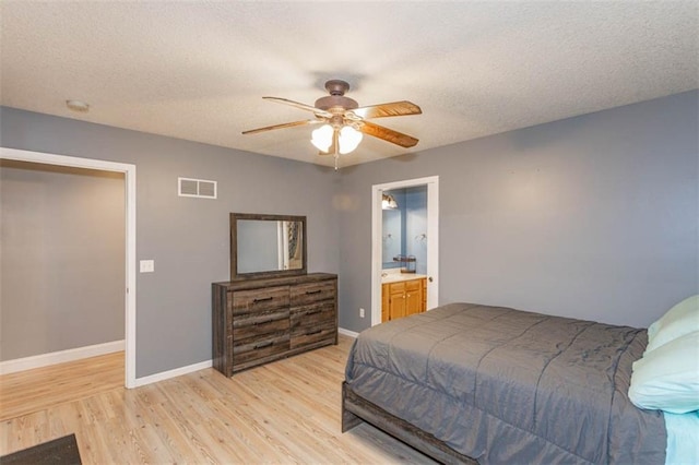 5990 Z Hwy, Edgerton, MO 64444 - bedroom with light wood-type flooring, baseboards, a textured ceiling, and a ceiling fan