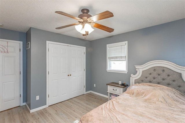 5990 Z Hwy, Edgerton, MO 64444 - bedroom featuring wood finished floors, baseboards, a closet, and a ceiling fan