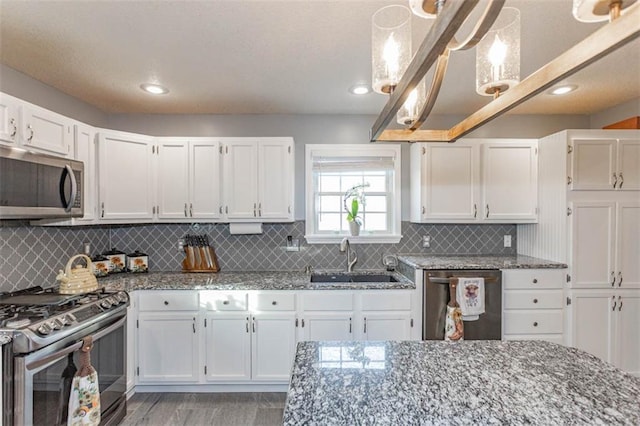 5990 Z Hwy, Edgerton, MO 64444 - kitchen featuring stainless steel appliances, a sink, stone counters, white cabinetry, and recessed lighting