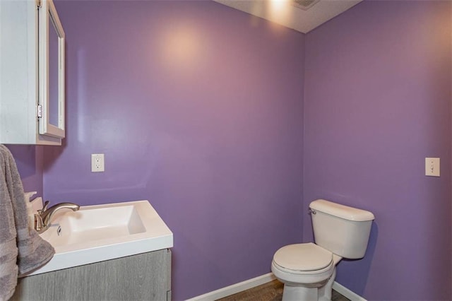 5990 Z Hwy, Edgerton, MO 64444 - bathroom with toilet, vanity, and baseboards