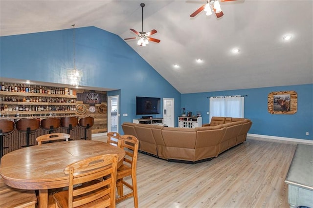 5990 Z Hwy, Edgerton, MO 64444 - living area with a ceiling fan, high vaulted ceiling, a bar, wood finished floors, and recessed lighting