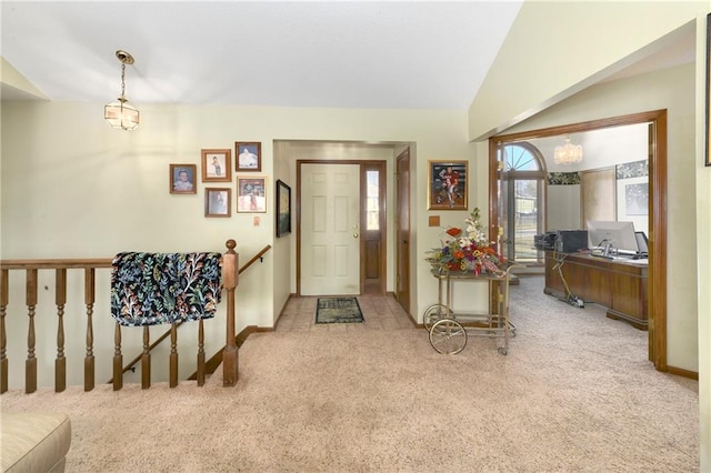 foyer entrance with carpet flooring and baseboards