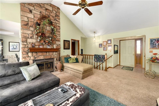 carpeted living room featuring high vaulted ceiling, a fireplace, and a ceiling fan