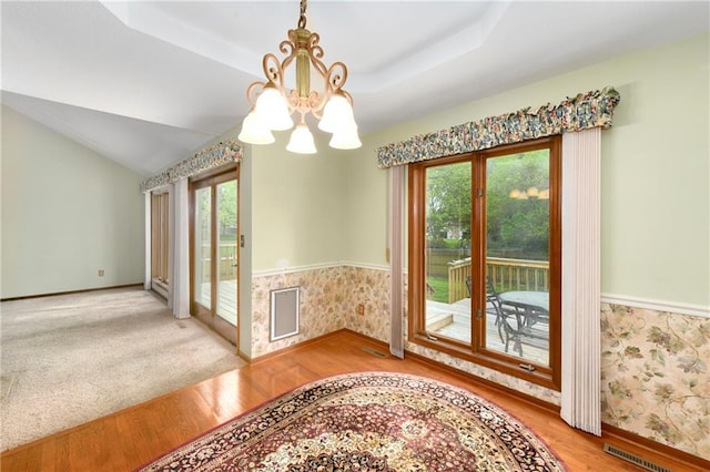 3824 SW Windemere Dr, Lees Summit, MO 64082 - doorway to outside with a chandelier, healthy amount of natural light, wood finished floors, baseboards, and wallpapered walls