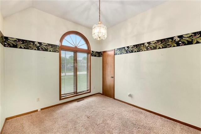 3824 SW Windemere Dr, Lees Summit, MO 64082 - carpeted spare room with a chandelier, vaulted ceiling, and baseboards