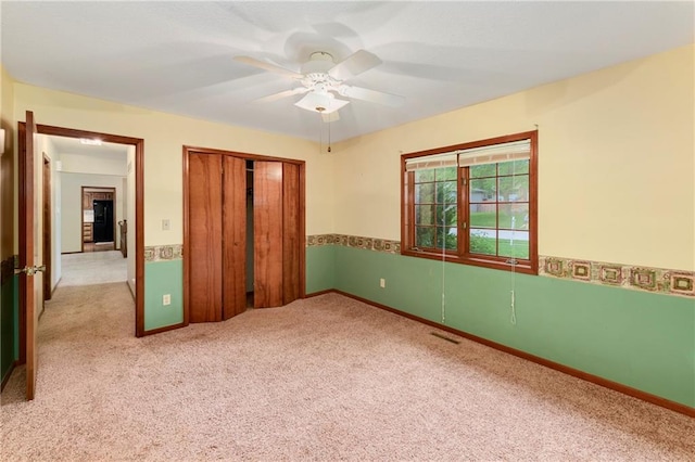 3824 SW Windemere Dr, Lees Summit, MO 64082 - unfurnished bedroom with carpet, a closet, baseboards, and ceiling fan
