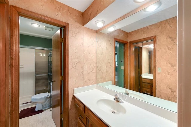 3824 SW Windemere Dr, Lees Summit, MO 64082 - bathroom with a shower stall, vanity, and toilet