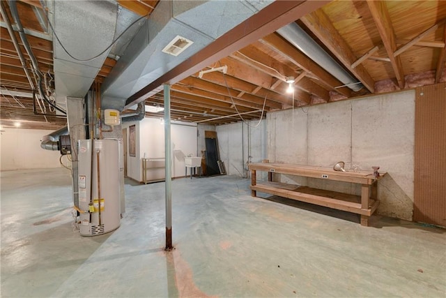 3824 SW Windemere Dr, Lees Summit, MO 64082 - unfinished below grade area featuring gas water heater and a sink