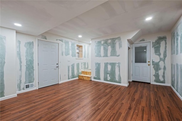 empty room featuring baseboards, visible vents, wood finished floors, and recessed lighting