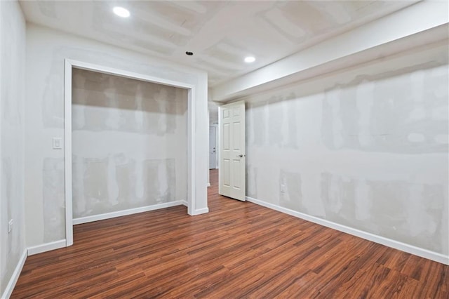 unfurnished bedroom featuring recessed lighting, baseboards, and wood finished floors