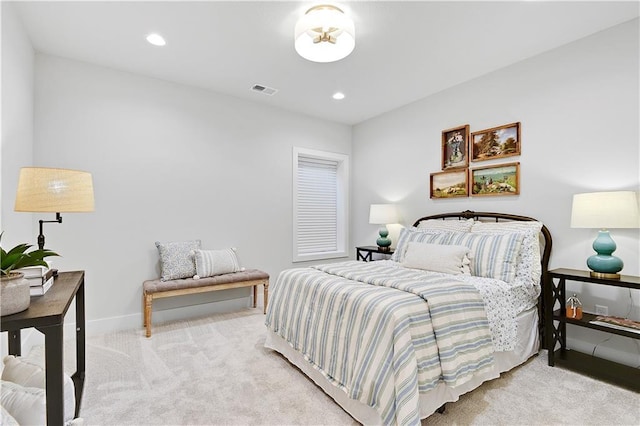 carpeted bedroom with recessed lighting, visible vents, and baseboards