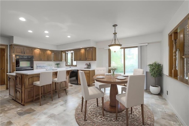 12016 Ballentine St, Overland Park, KS 66213 - dining area with light stone finish flooring, plenty of natural light, recessed lighting, and baseboards
