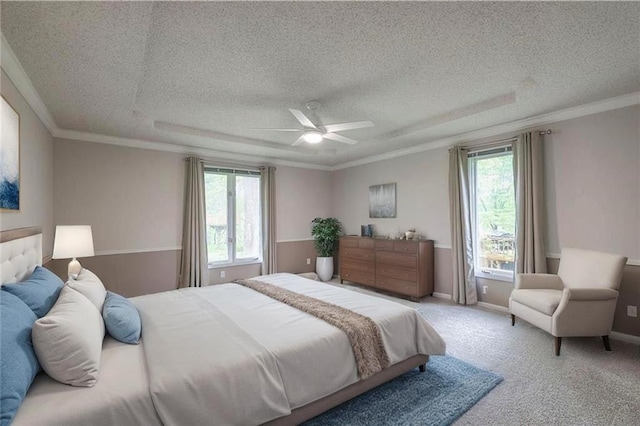 12016 Ballentine St, Overland Park, KS 66213 - carpeted bedroom with multiple windows, a textured ceiling, ceiling fan, and ornamental molding
