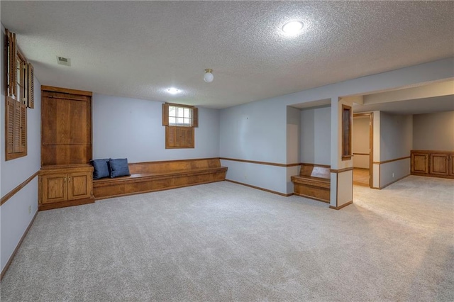 12016 Ballentine St, Overland Park, KS 66213 - basement with a textured ceiling, light colored carpet, and baseboards