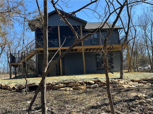 back of property with stairs