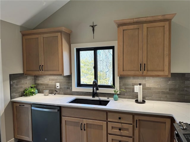 kitchen with a sink, backsplash, lofted ceiling, dishwasher, and light stone countertops