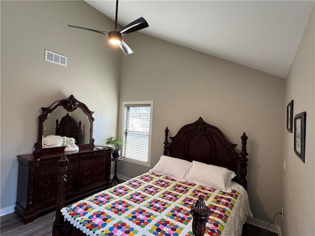 bedroom with wood finished floors, baseboards, visible vents, high vaulted ceiling, and ceiling fan