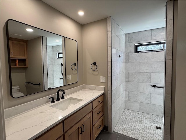 full bath with recessed lighting, walk in shower, vanity, and tile patterned flooring