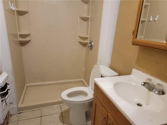 full bathroom with vanity, tile patterned flooring, toilet, and a shower stall