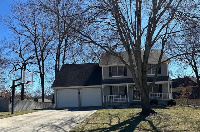 view of front of property featuring covered porch, fence, a garage, driveway, and a front lawn